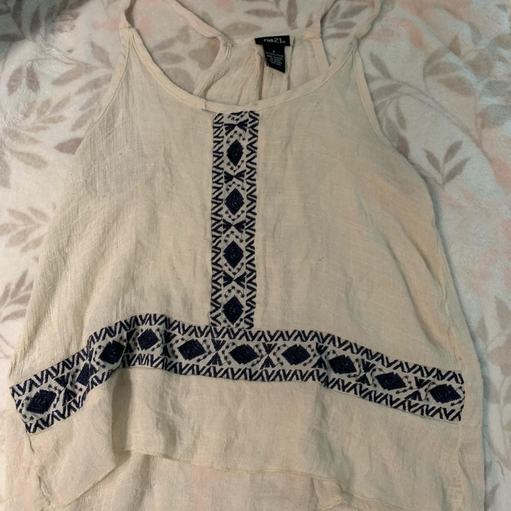 Tan shirt with blue details